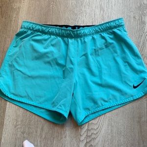 Turquoise Nike running shorts